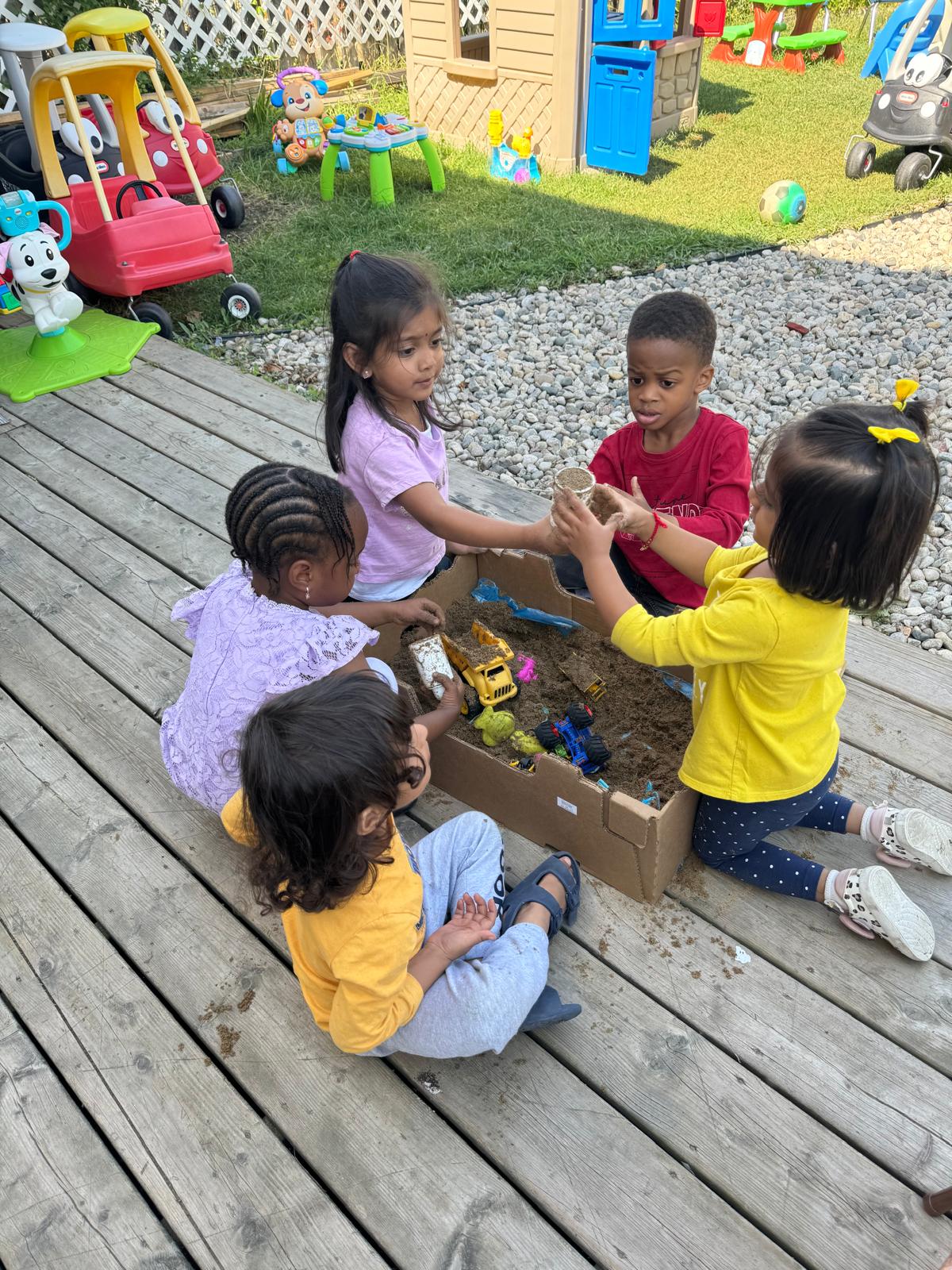 Children engaged in creative learning activities at Regina daycare